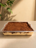Sharing-size tiramisu tray dusted with cocoa